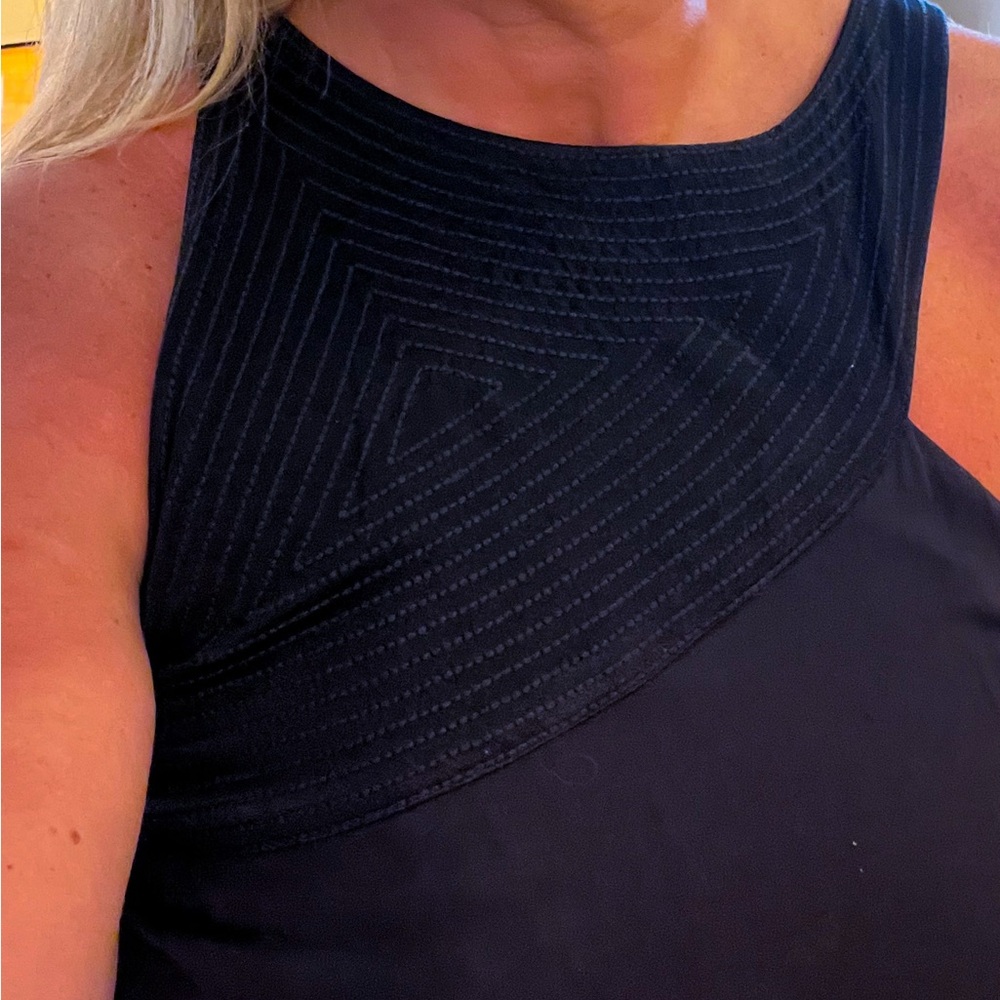 Anthropologie Black  asymmetrical cut out neckline and back…